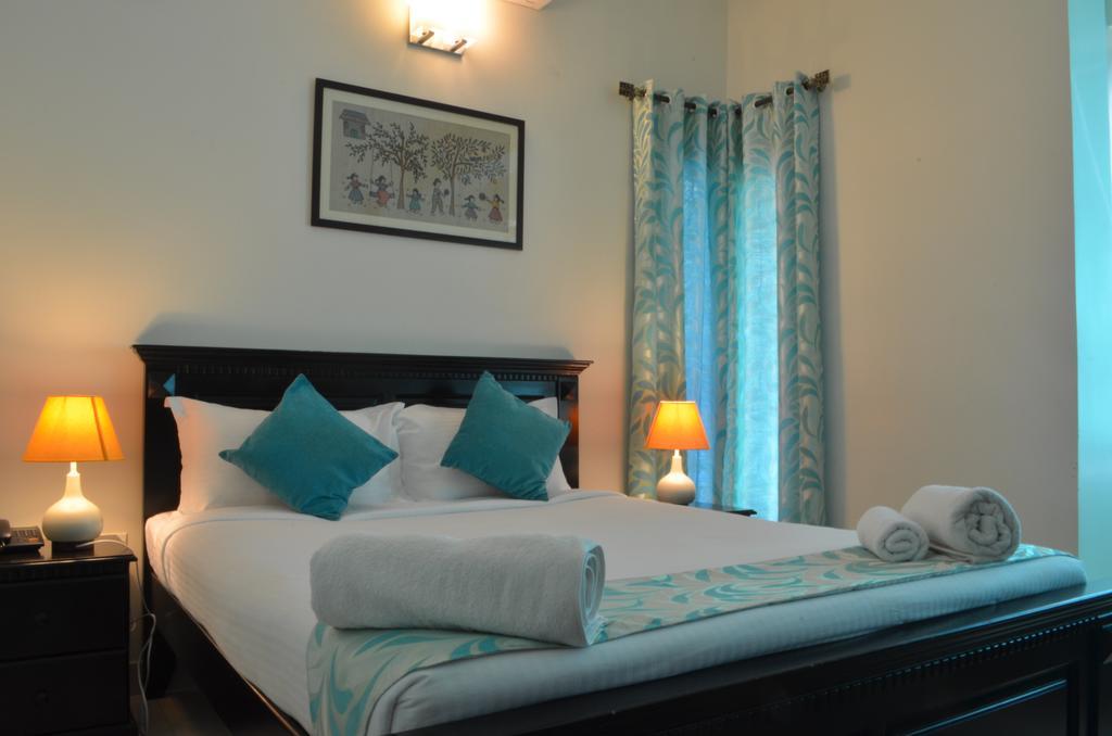 Luxtay Suites Бенґалуру Номер фото